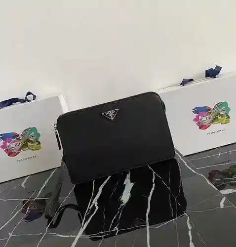 PRA@DA El bolso exclusivo para hombres está hecho de piel de vaca original importada y una bolsa de 