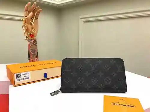 La billetera con clip largo exclusiva para hombres adopta una versión de réplica de lona original im