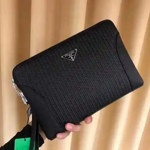 PRA@DA El único bolso para hombre está hecho de piel de vaca original importada y una bolsa de regal