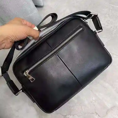 PRA@DA El bolso cruzado para hombre está hecho de cuero original importado de primer nivel y una ver