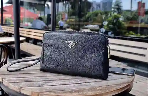 PRA@DA El bolso exclusivo para hombres está hecho de piel de vaca original importada y una bolsa de 