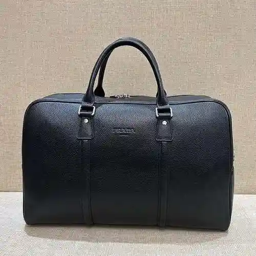 PRA@DA La bolsa de viaje exclusiva para hombres está hecha de cuero original importado de primer niv