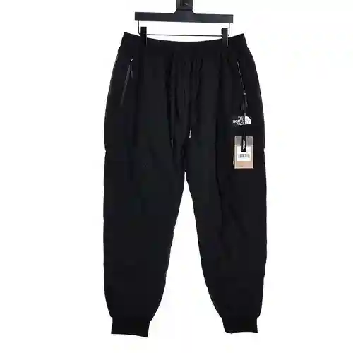 Pantalones acolchados con bolsillo laminado y etiqueta pequeña de TNF