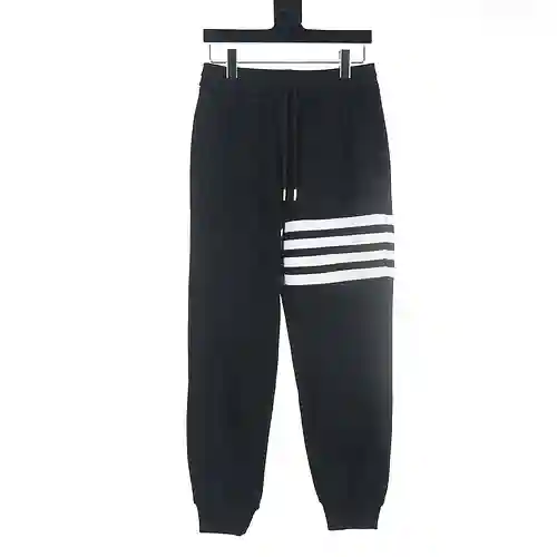 Tom Brown TB pantalones deportivos de polar con diseño de patchwork y cuatro barras