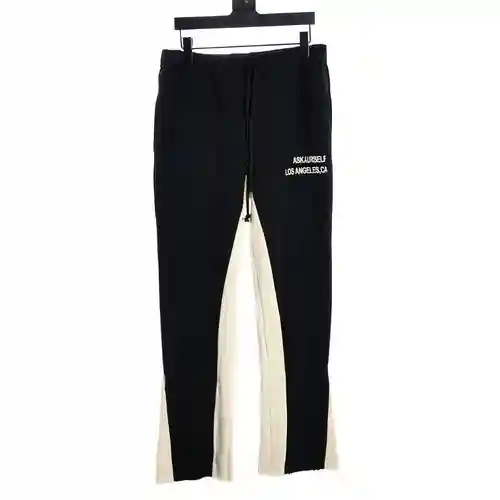 ASKYURSELF 23FW pantalones de chándal con corte de bota gris y logo sánscrito bordado, pantalones in