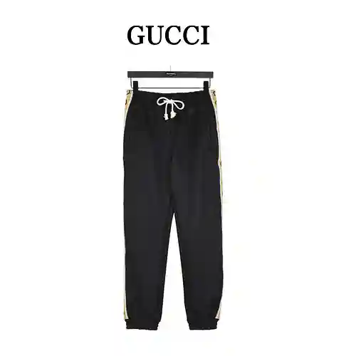 Pantalones de traje con cinta reflectante y doble G lateral clásica de G*cci/Gucci
