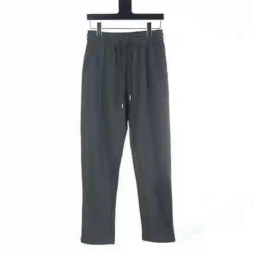 Prada PRD 23Fw pantalones de algodón en relieve con bolsillo de cuero y letras bordadas