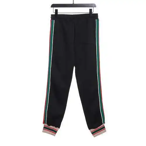 GU*CCI Gucci pantalones clásicos de tela jacquard con estampado oscuro en rojo y verde