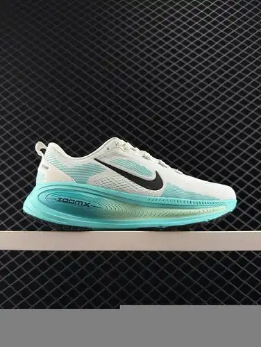 The Nike Vomero 18 is a low cut green gray casual running shoe that is fashionable, comfortable, sli