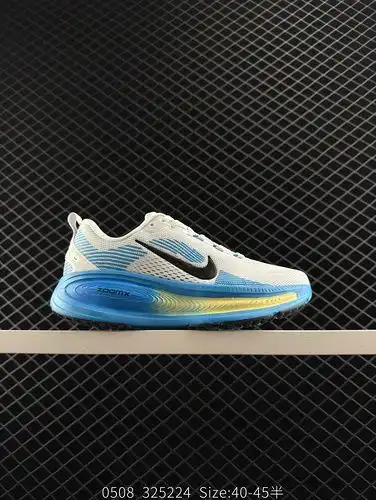 The Nike Vomero 18 is a low cut white, blue, and yellow casual running shoe that is fashionable, com