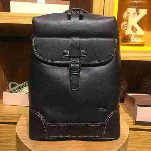La mochila para hombre está hecha de piel de vaca original importada, con una bolsa de regalo de ent