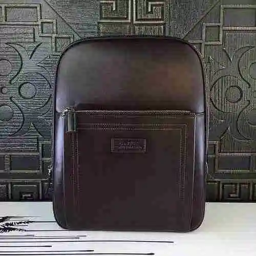 La mochila para hombre está hecha de piel de vaca original importada, con una bolsa de regalo de ent