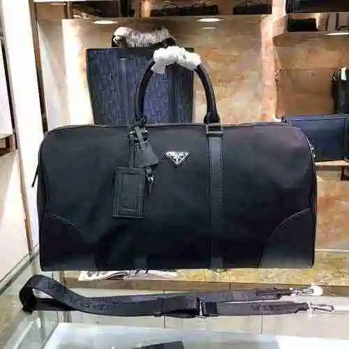 La bolsa de viaje exclusiva para hombres está hecha de nailon original importado de primer nivel, ve