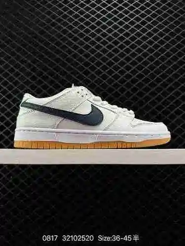 El auténtico cuerpo del zapato Nike SB Dunk Low "Orange Label" de caucho crudo blanco y az