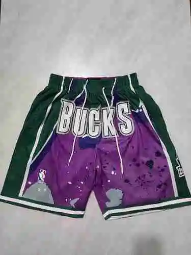 Buck pantalones de fútbol morados con bolsillo oscilante